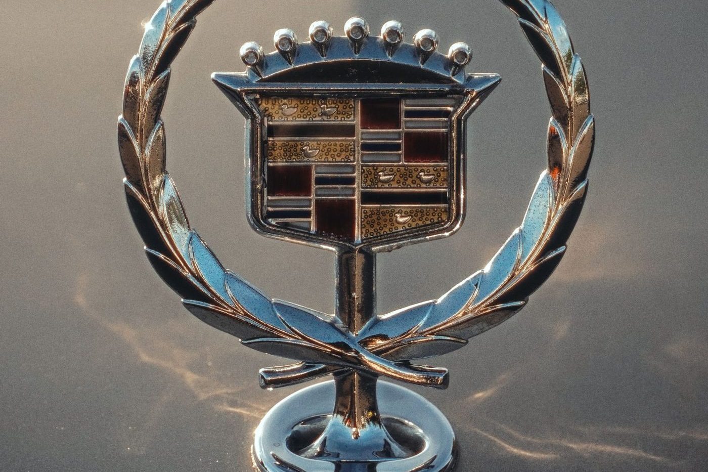 Cadillac crest and wreath bonnet mascot on a vintage car