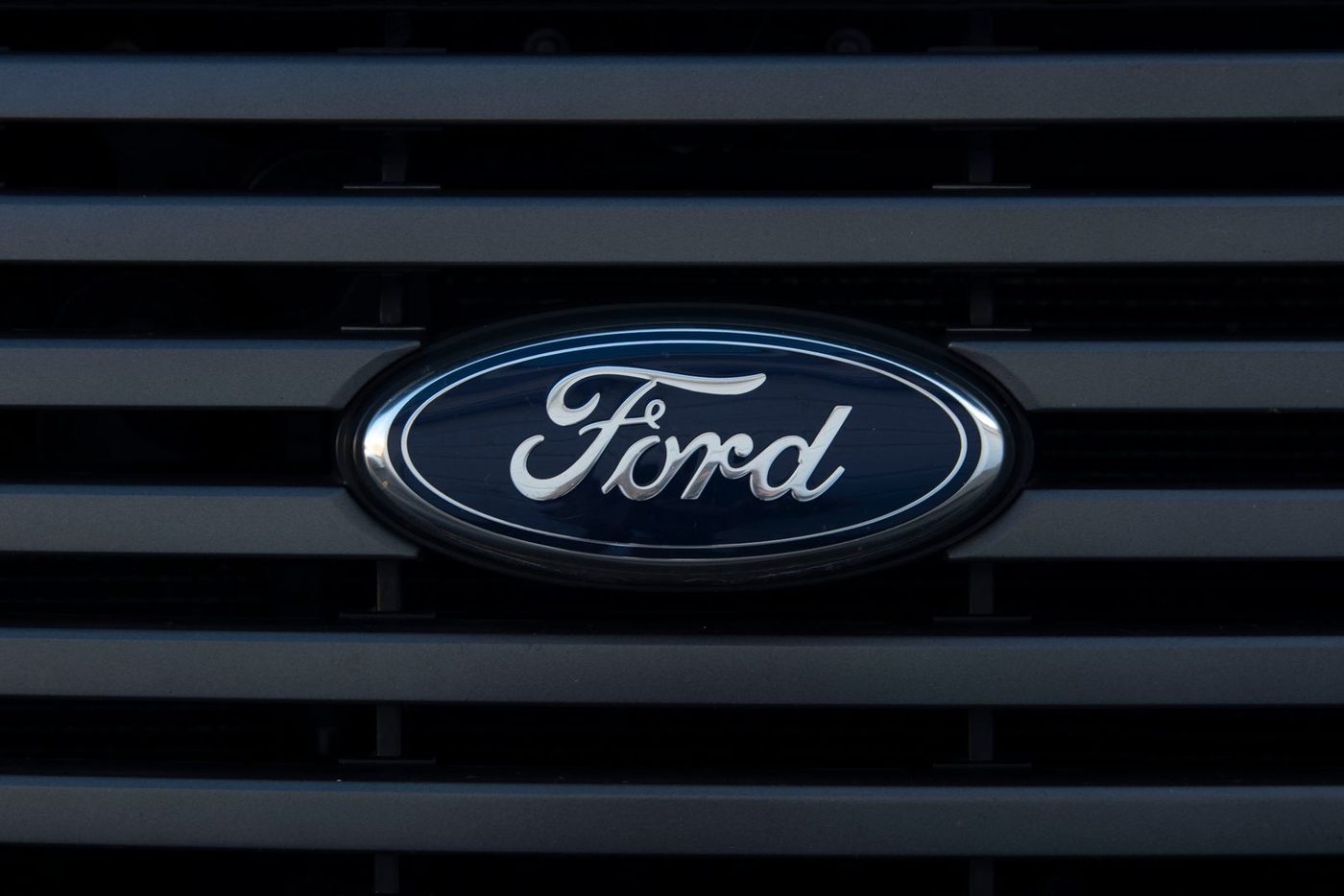 Ford blue oval badge on a black grille